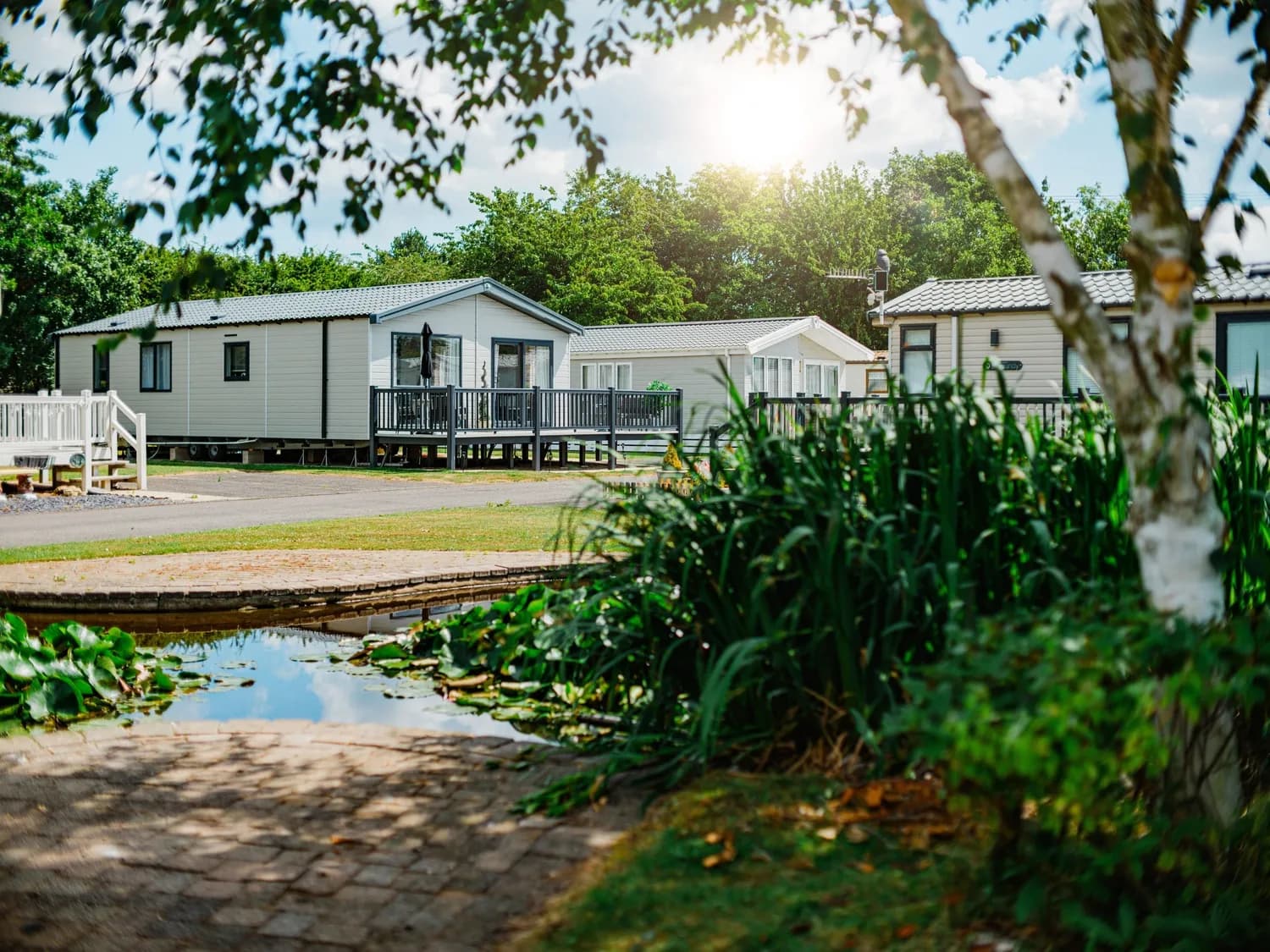 Roach Farm Ornamental Pond with Caravans and Surrounding Greenery 2
