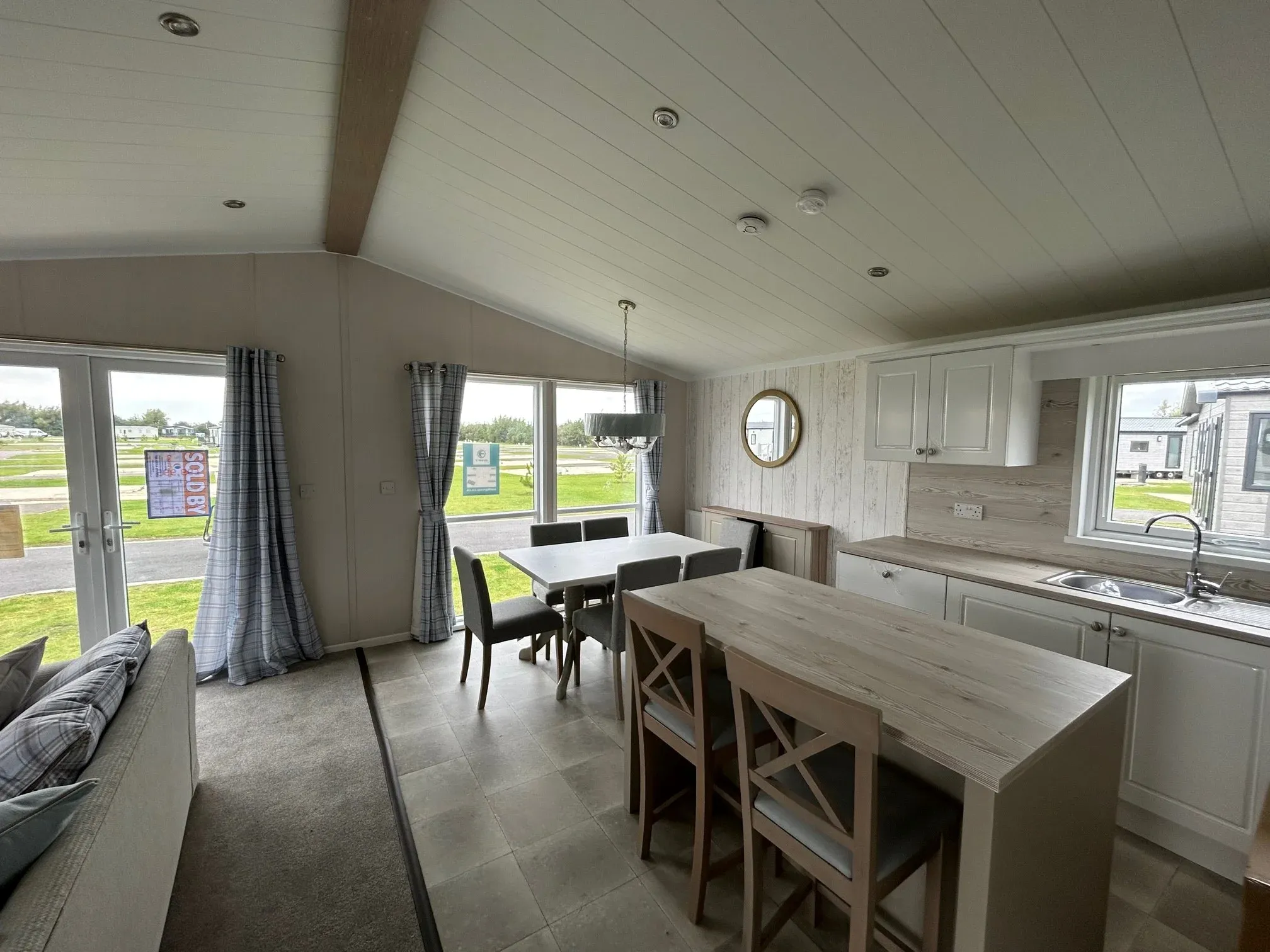 Bright living and dining area in the 2023 Swift Edmonton lodge