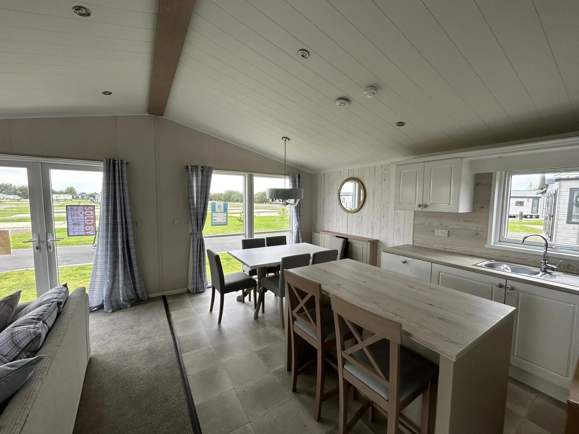 Bright living and dining area in the 2023 Swift Edmonton lodge