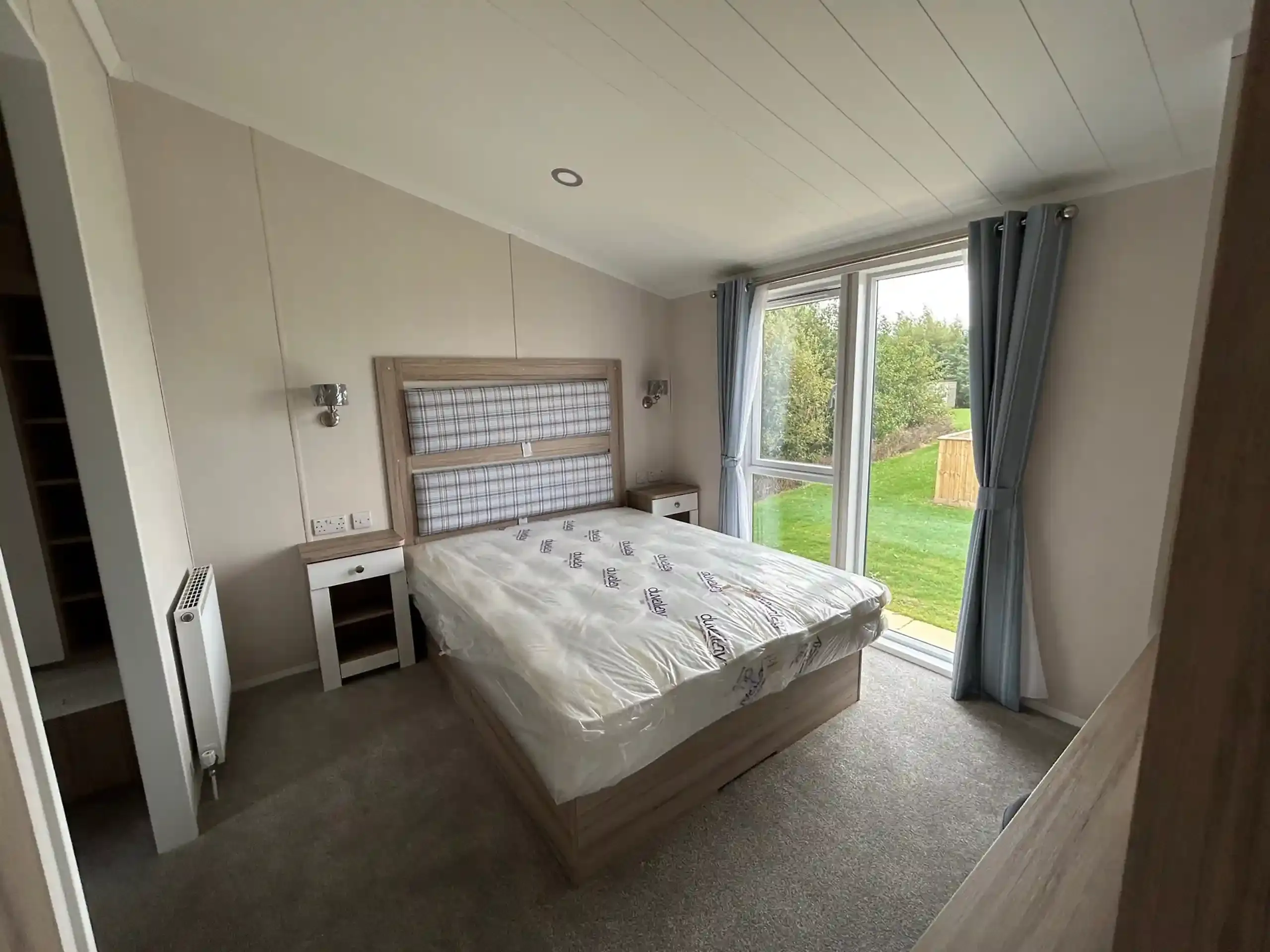 Master bedroom with en-suite shower room in the 2023 Swift Edmonton