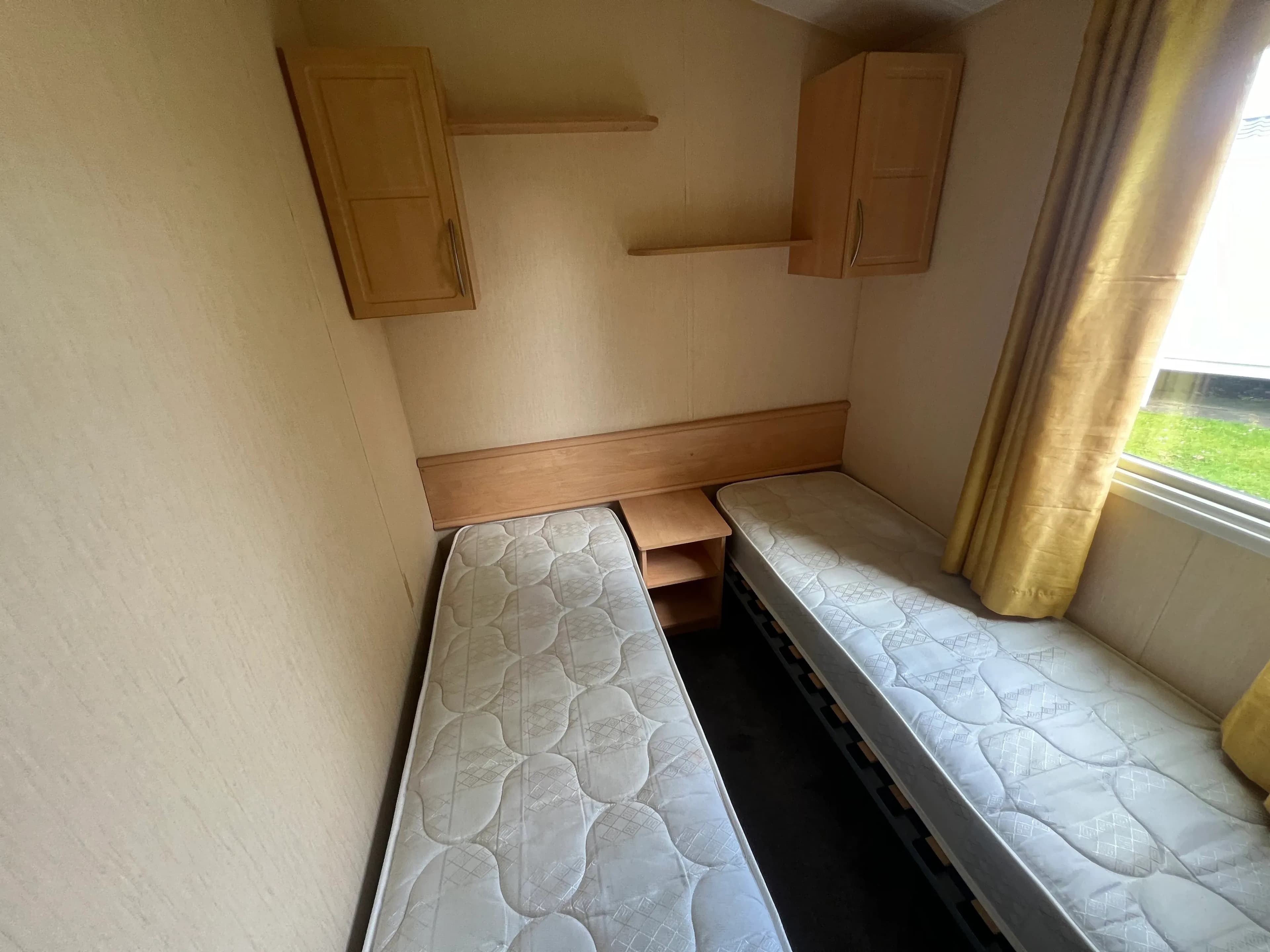 Twin bedroom inside the 2012 Willerby Rio Gold 2-bedroom caravan