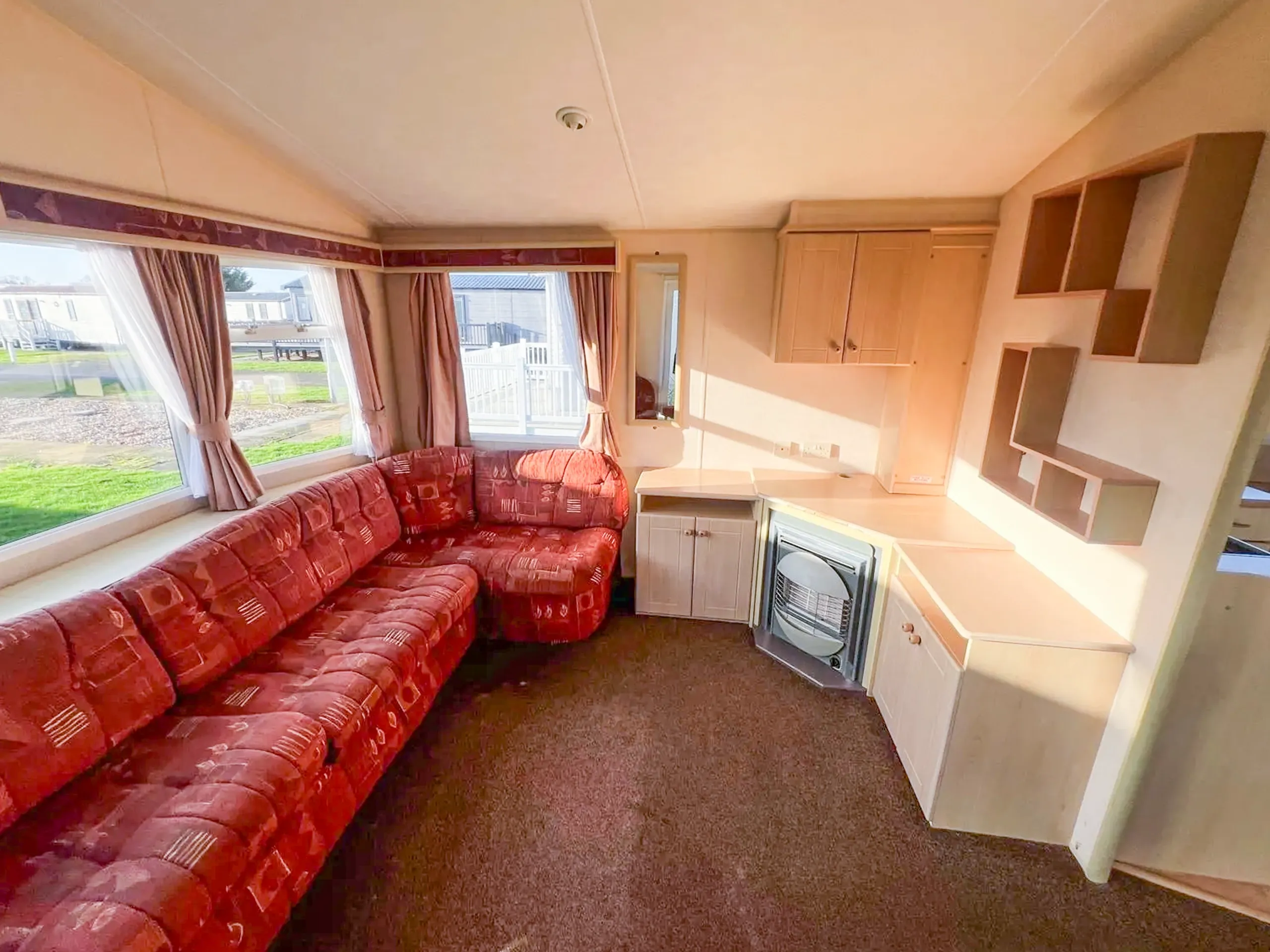 Willerby Richmond caravan interior living room with seating and fireplace