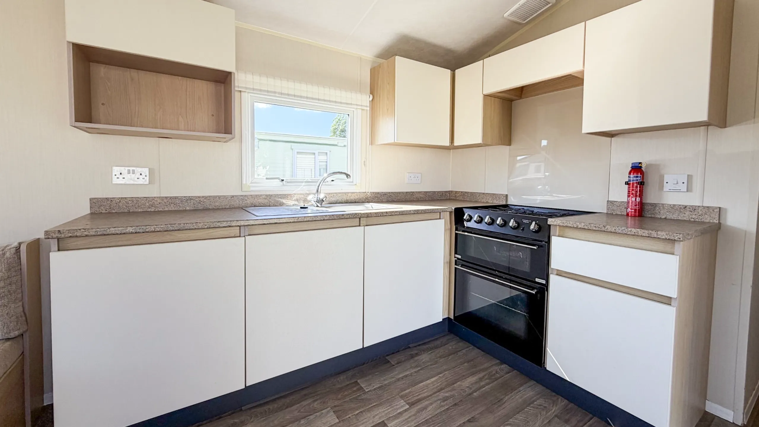 Modern fitted kitchen in the 2015 Willerby Aurora static caravan.