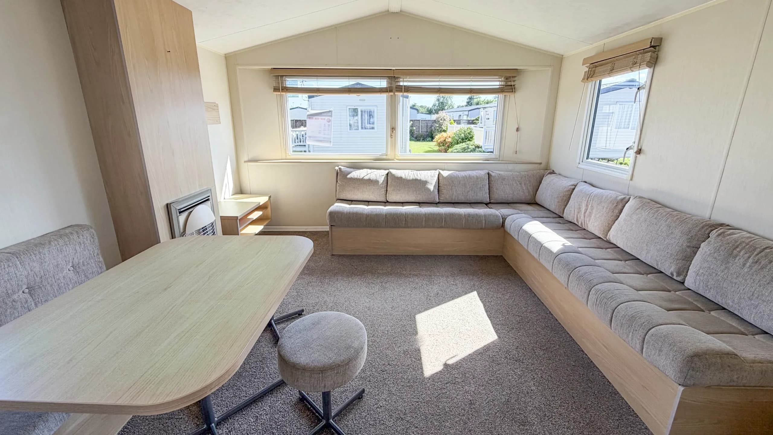 Bright open-plan lounge inside the 2015 Willerby Aurora holiday home.