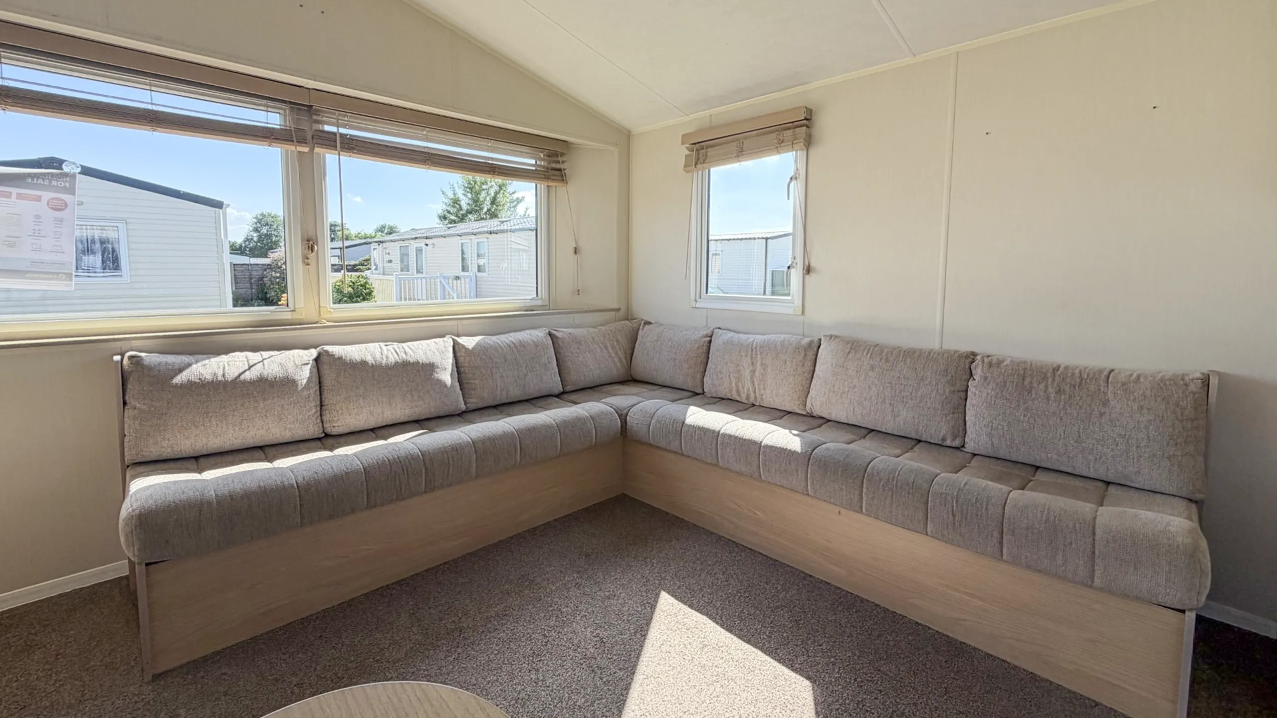 Bright open-plan lounge inside the 2015 Willerby Aurora holiday home.
