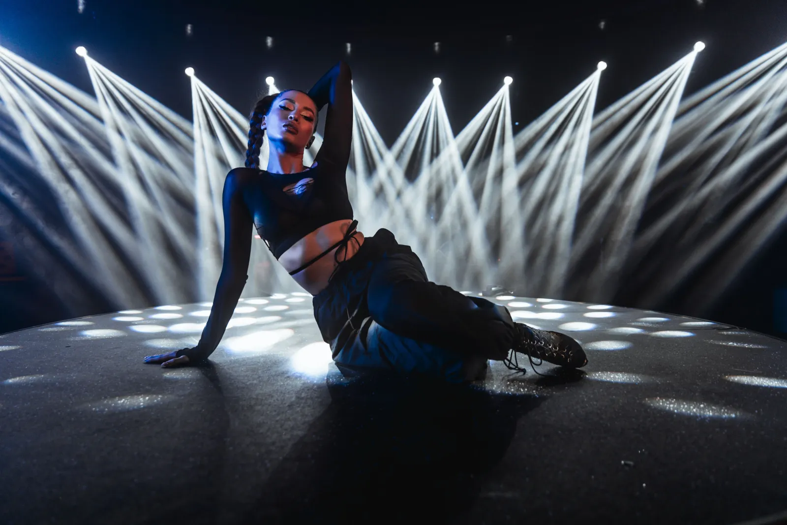 attractive-woman-posing-on-a-club-stage-with-neon-2025-02-11-21-19-47-utc.jpg