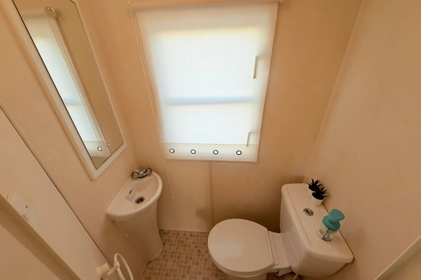Separate WC with toilet and hand basin in the 2004 Atlas Heritage holiday home