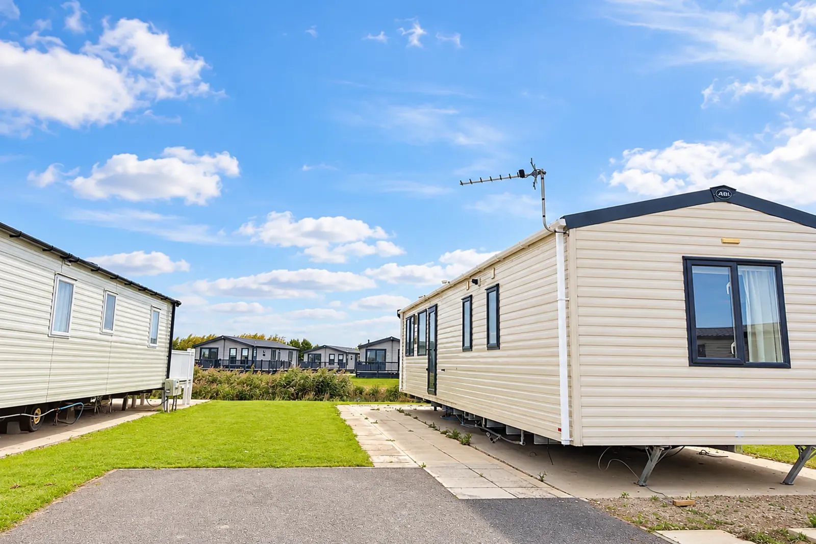 2016 ABI Sunset Coastfields exterior with nearby fishing lake and Sunset model badge