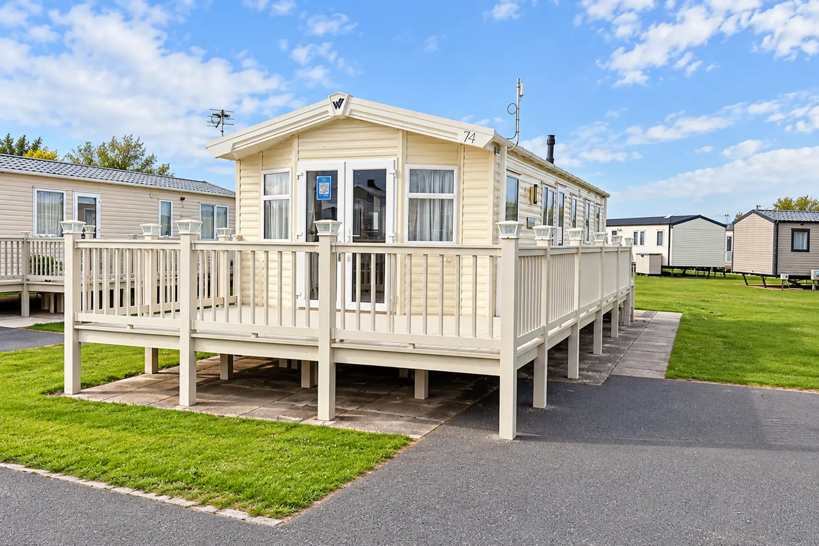 2016 Willerby Brockenhurst Coastfields exterior with extensive wraparound decking