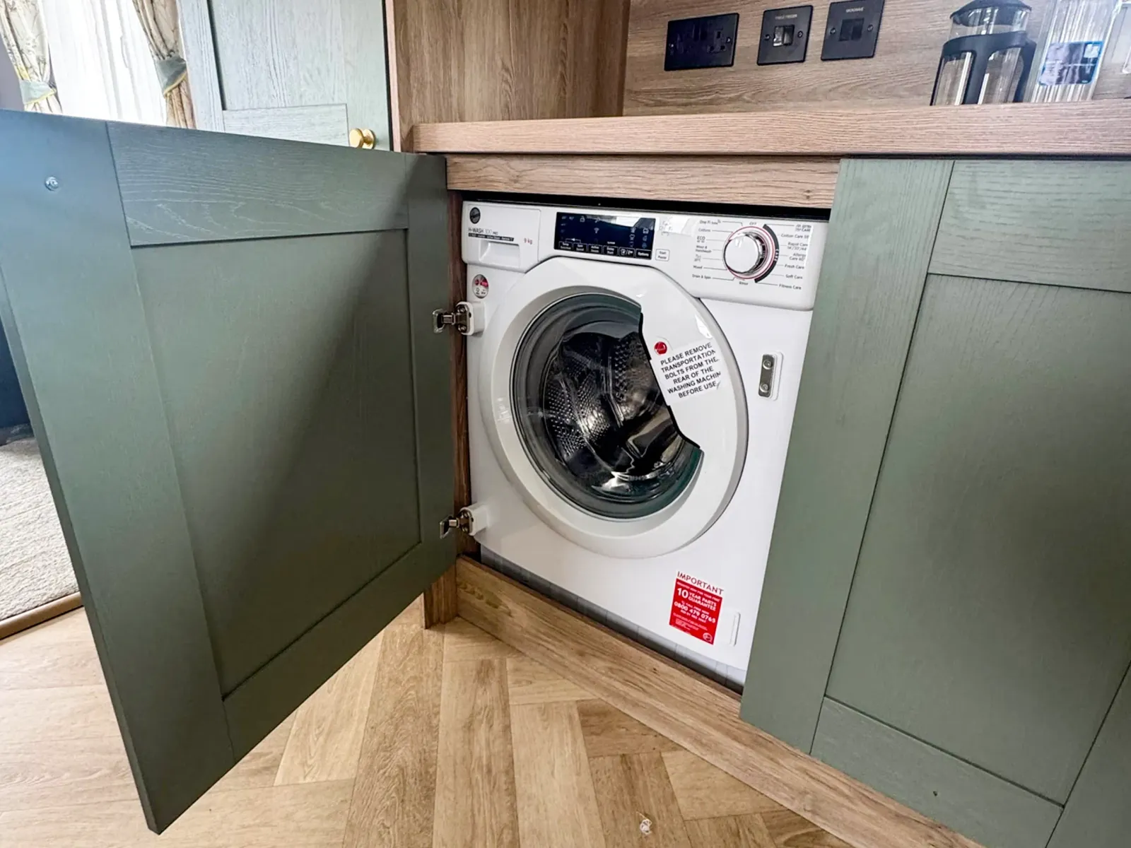 Modern kitchen with washer in the 2023 ABI Ingleton holiday home