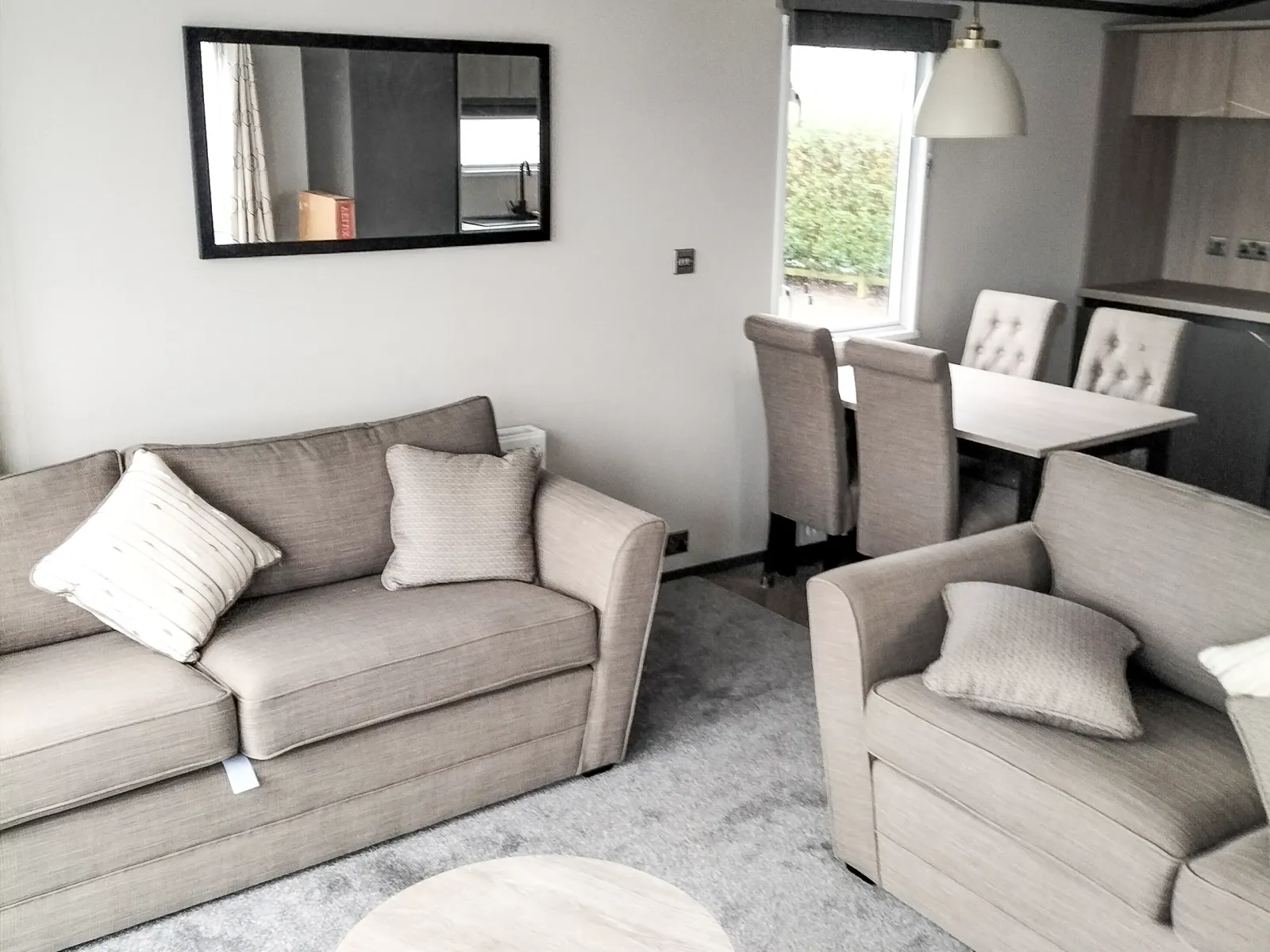 Bright and contemporary living area in the 2023 Victory Lakewood Lodge