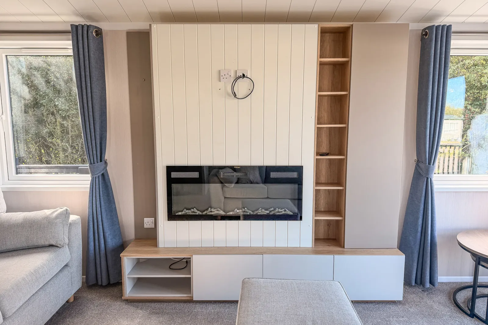 2026 Swift Edmonton Lodge Coastfields lounge with feature fireplace