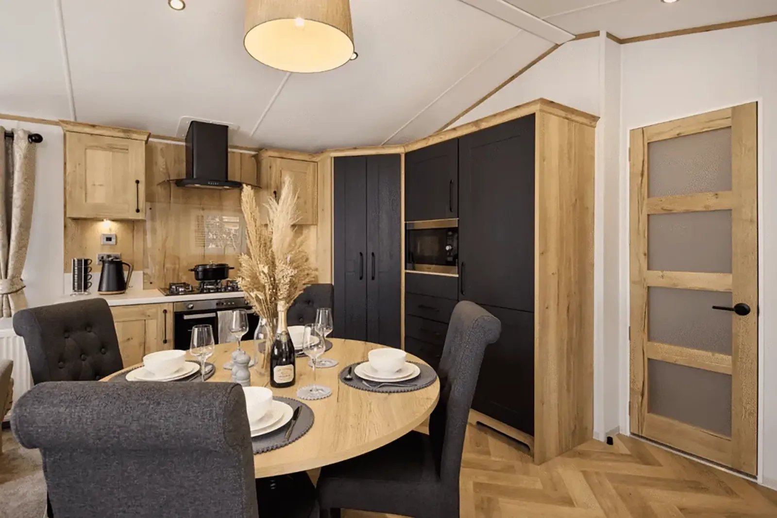 Stylish dining area with freestanding table and upholstered chairs in the 2026 Willerby Dorchester
