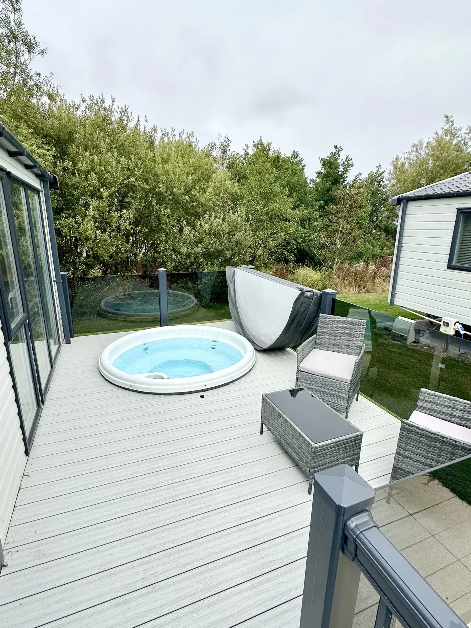 Outside decking area with hot tub of the 2023 Victory Lakewood Lodge