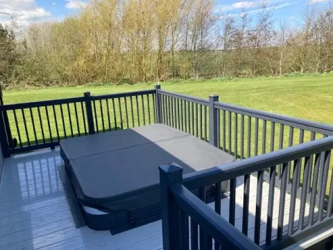Private hot tub on the decking of the 2023 Willerby Portland Lodge