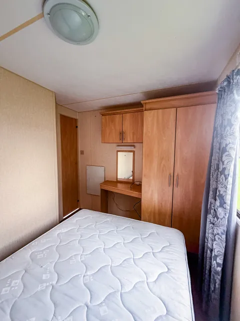A secondary view of the master bedroom on an ABI Colorado with wardrobe and dressing table for sale in skegness