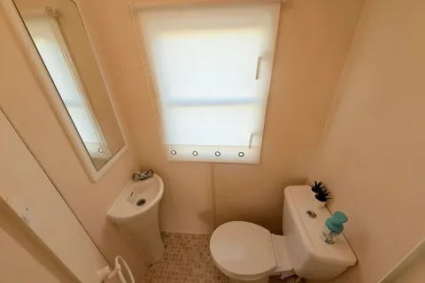 Separate WC with toilet and hand basin in the 2004 Atlas Heritage holiday home