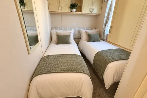 Twin bedroom with two single beds in the 2004 Atlas Heritage three-bedroom holiday home
