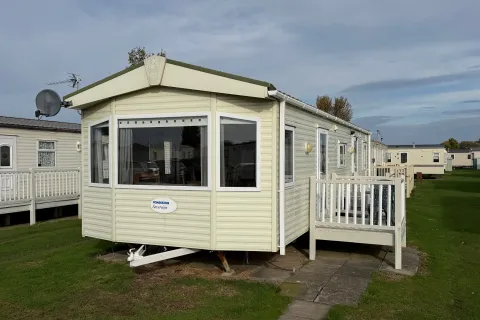 2008 Pemberton Sovereign holiday home with entrance decking at North Shore Holiday Park