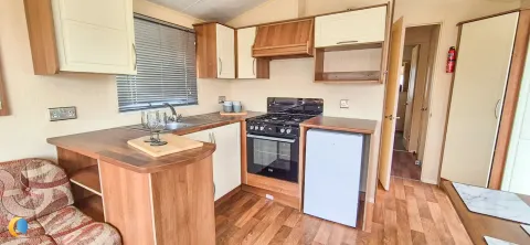 Coastfields 2012 Willerby Rio Gold fitted kitchen with worktop and storage space