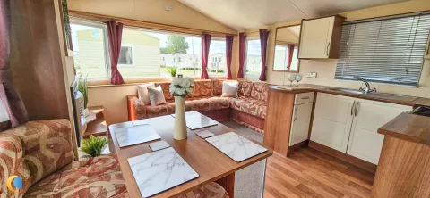 Coastfields 2012 Willerby Rio Gold open-plan living and dining area with red interior finish