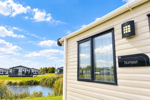 2016 ABI Sunset Coastfields exterior situated beside fishing lake at Grange Leisure Park