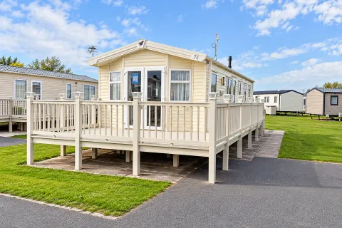 2016 Willerby Brockenhurst Coastfields exterior with extensive wraparound decking