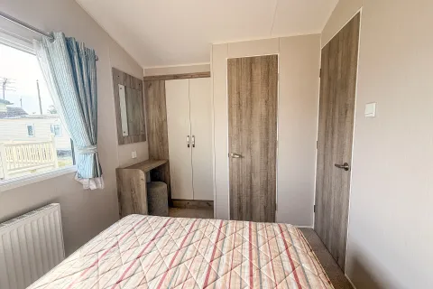 2018 Willerby Skye Coastfields master bedroom with fitted storage