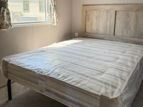 Master bedroom in the 2026 ABI Seaspray holiday home