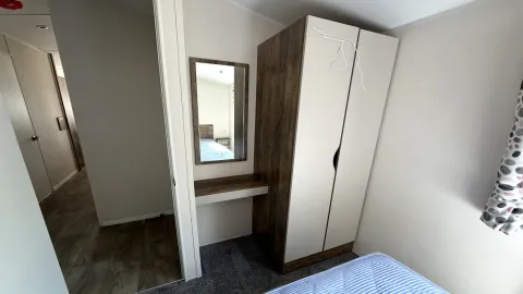 Text for iCoastfields 2026 Willerby Malton master bedroom storage at North Shore Holiday Park 
