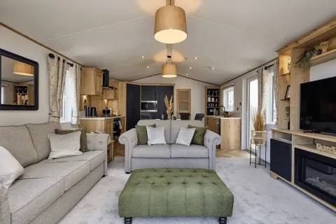 Elegant open-plan lounge with freestanding sofas and contemporary furnishings in the Willerby Dorchester holiday home