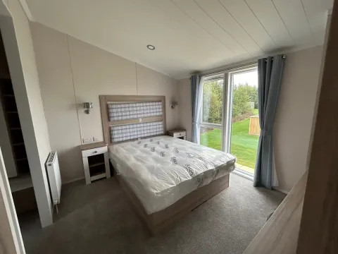 Master bedroom with en-suite shower room in the 2023 Swift Edmonton