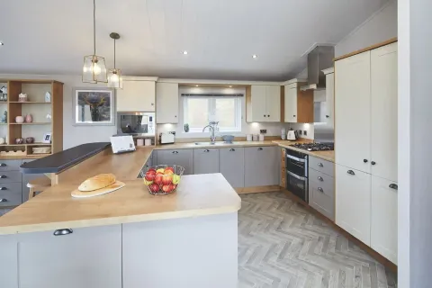 Shaker-style kitchen with integrated appliances in the 2023 Willerby Portland Lodge