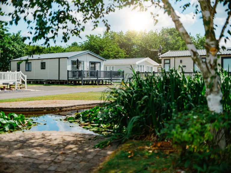 Roach Farm Ornamental Pond with Caravans and Surrounding Greenery 2