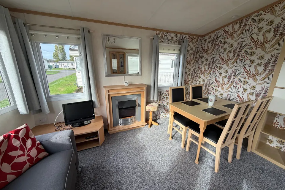 Spacious lounge with comfortable sofas and dining area in the 2008 Pemberton Sovereign