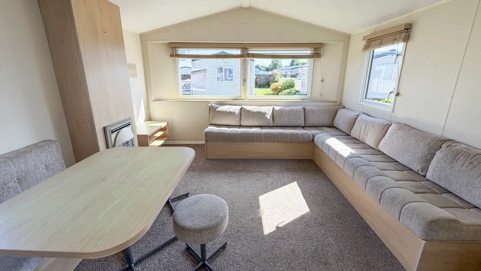 Bright open-plan lounge inside the 2015 Willerby Aurora holiday home.