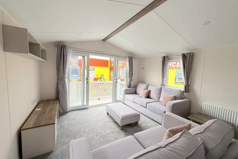 TBright modern lounge with comfortable seating and patio doors in the 2026 Willerby Malton at Coastfields Addlethorpe Golf & Country Clubext for image