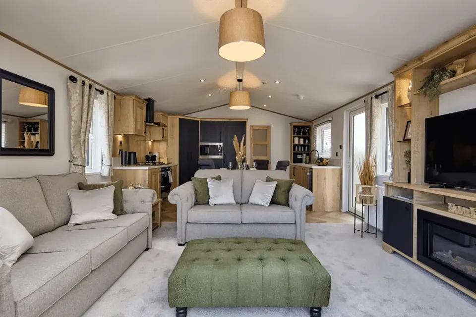 Elegant open-plan lounge with freestanding sofas and contemporary furnishings in the Willerby Dorchester holiday home