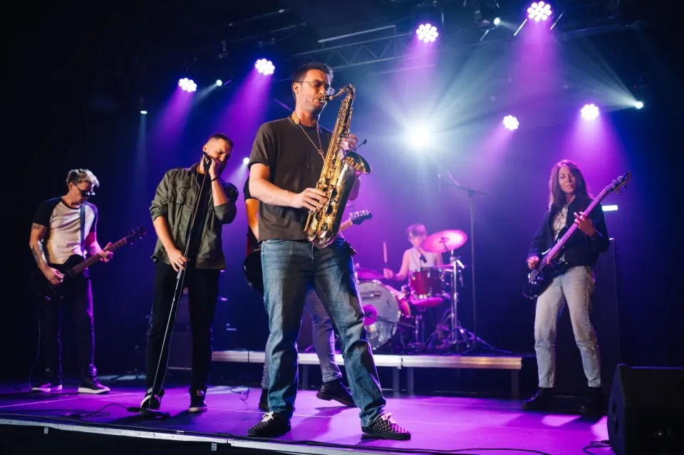 music-band-playing-live-on-stage-under-purple-ligh-2025-03-30-22-23-50-utc.jpg