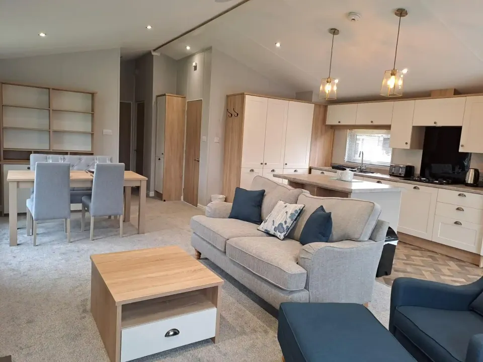 Modern kitchen with central island in the 2022 Willerby Pinehurst Lodge