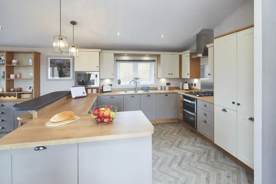 Shaker-style kitchen with integrated appliances in the 2023 Willerby Portland Lodge